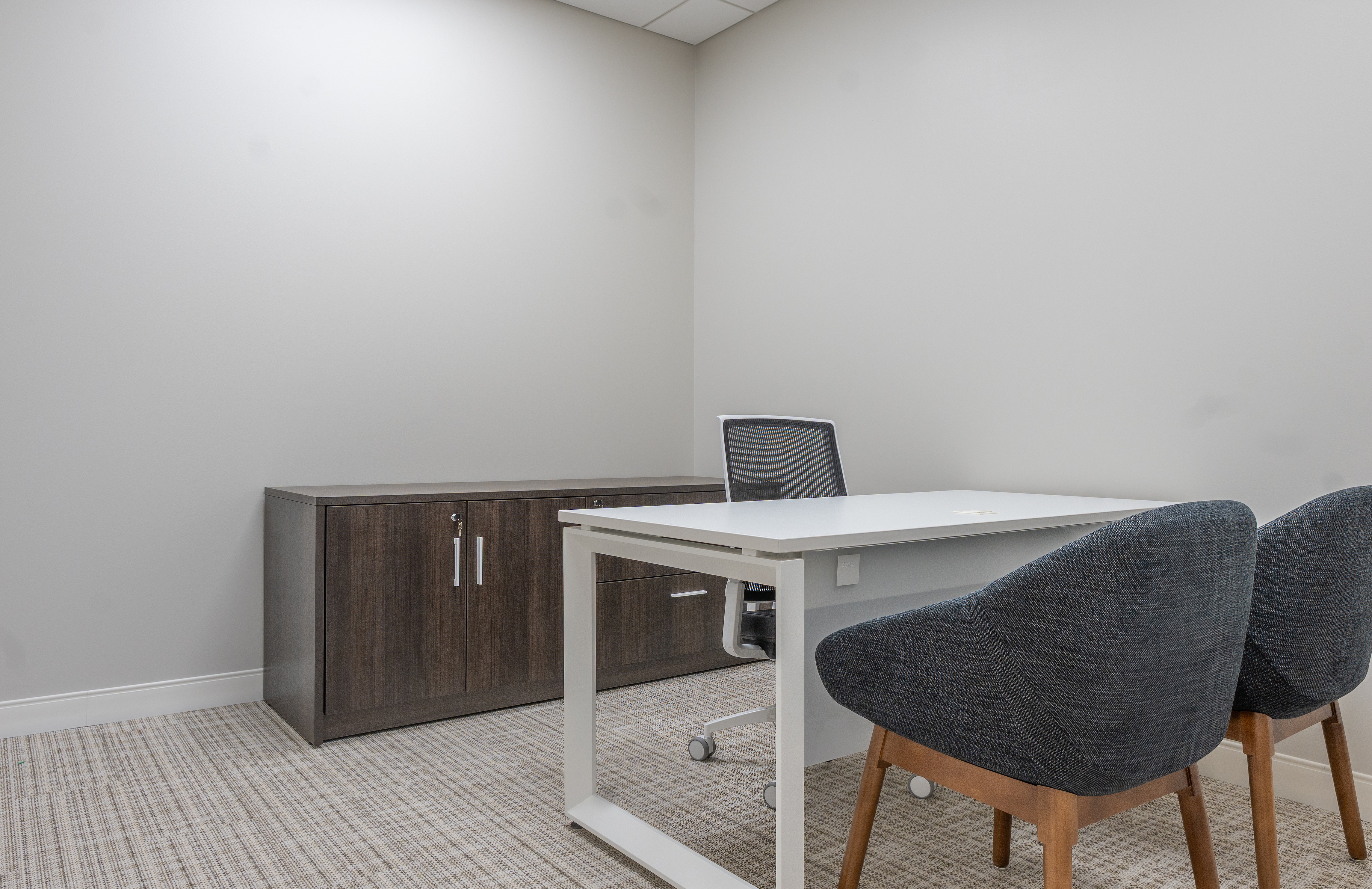 Commercial furniture liquidation crew clearing office furnishings